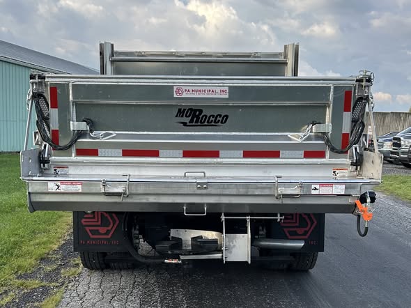 Rear view of municipal aluminum dump body work truck with Morocco Welding branding