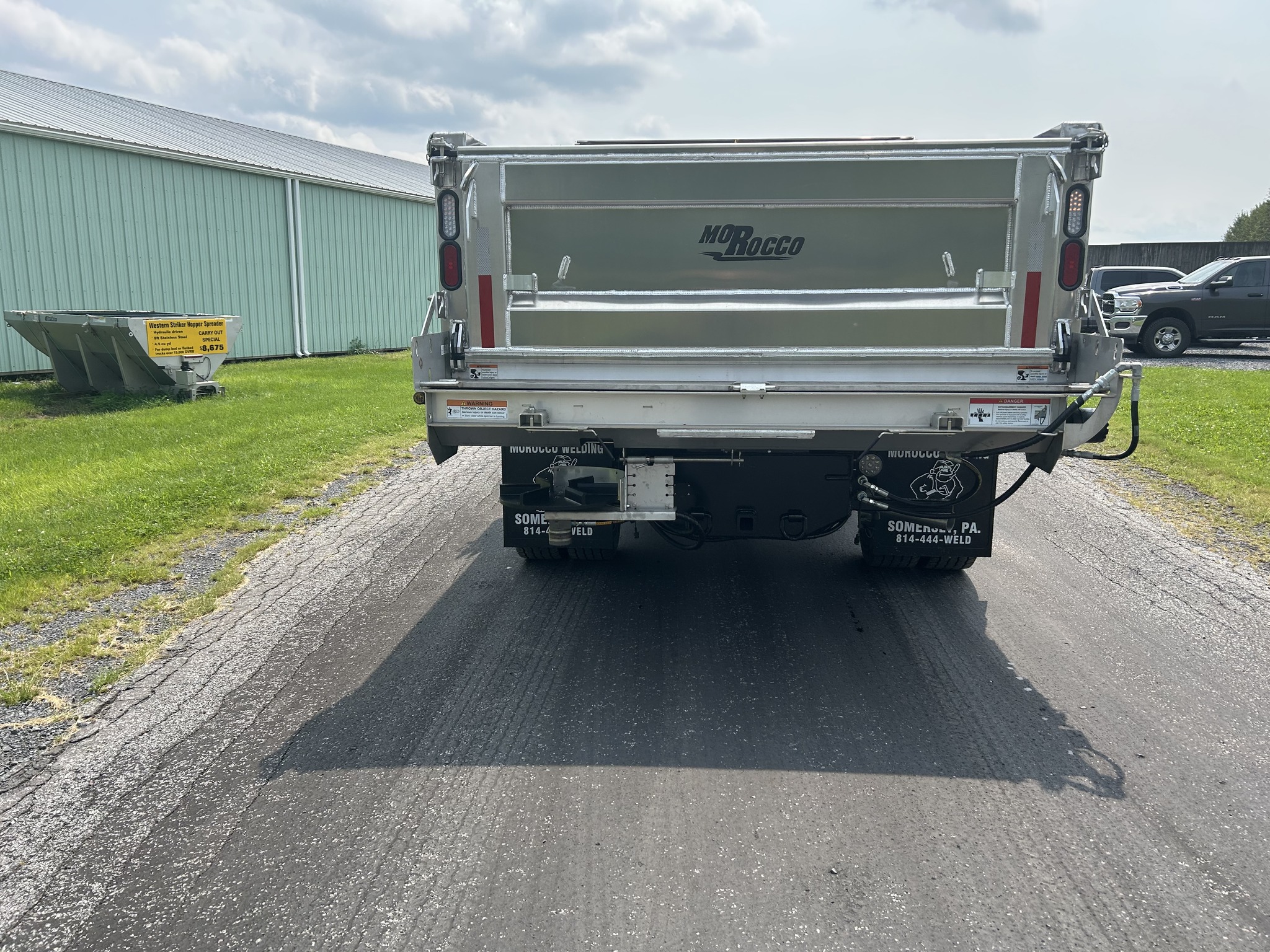 Rear view of a Morocco Welding aluminum dump body with a Flink-Bonnell stainless steel tailgate spreader mounted to the tailgate.