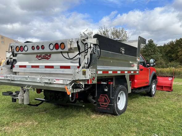 Rear view of a PA Municipal work truck with Buyers stainless steel spreader and aluminum dump body